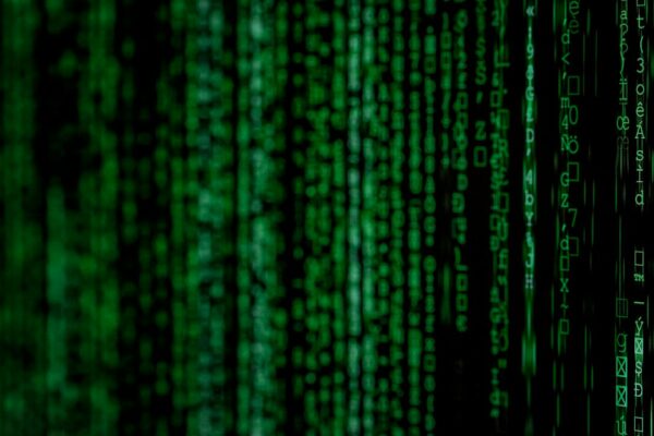 Glowing green digital code representing Base64 text encoding
